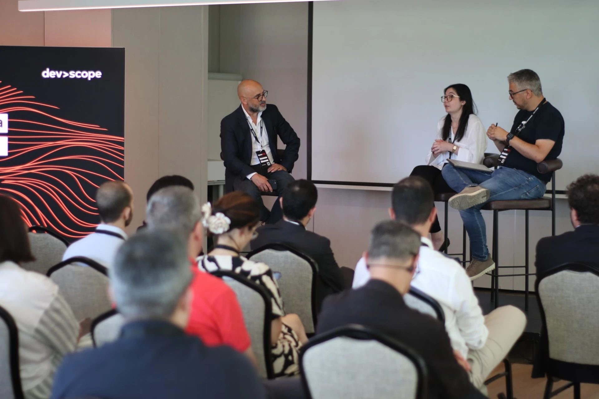 Open Day Lisbon 2026 - panel discussion in front of the DevScope backdrop